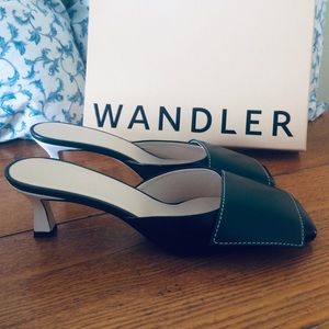 WANDLER Isa two-tone leather mules.